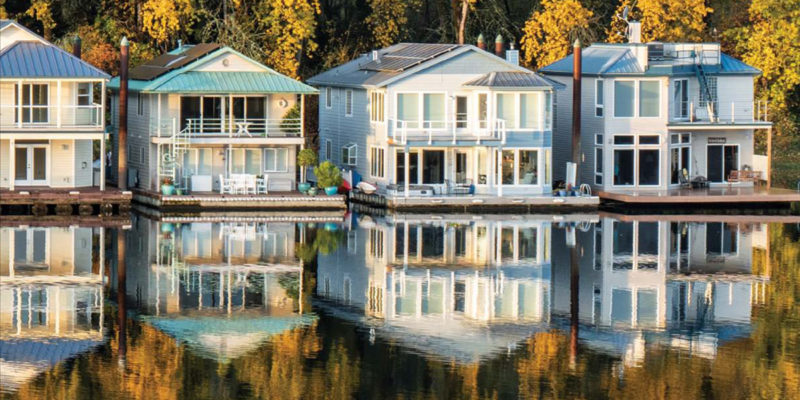 floating homes reflected in river
