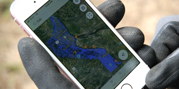 smart phone with view of map and data point app