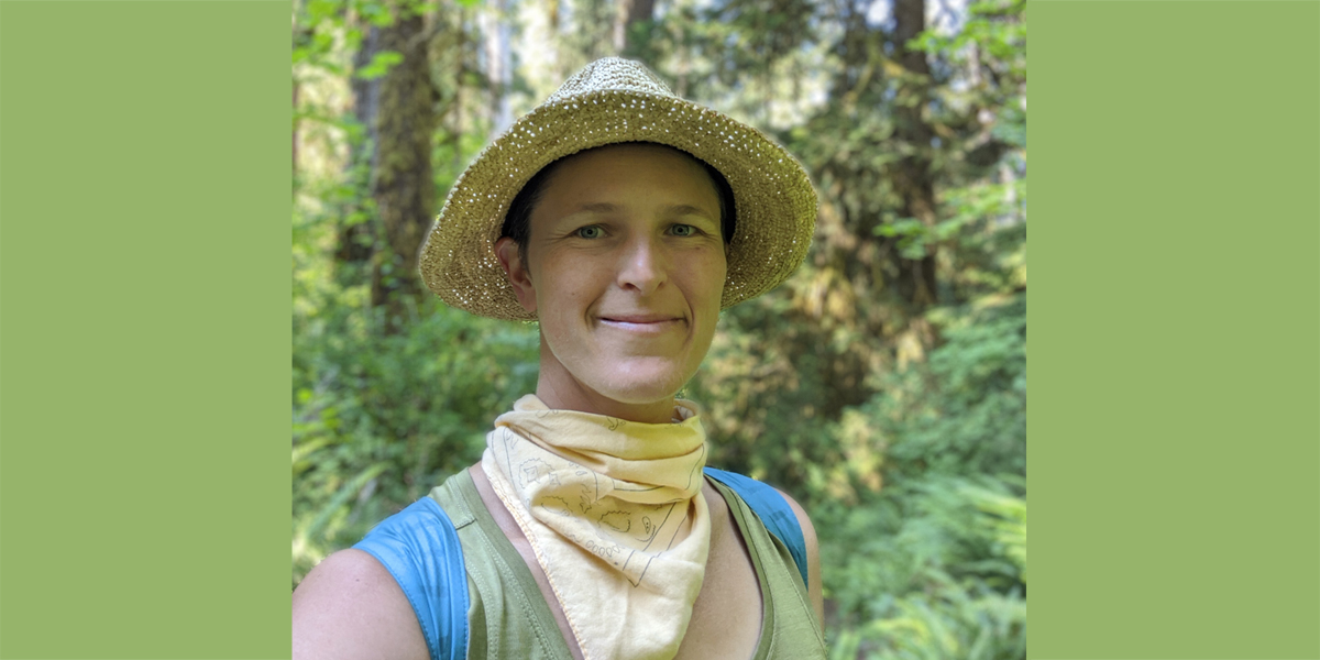 person in straw hat in forest